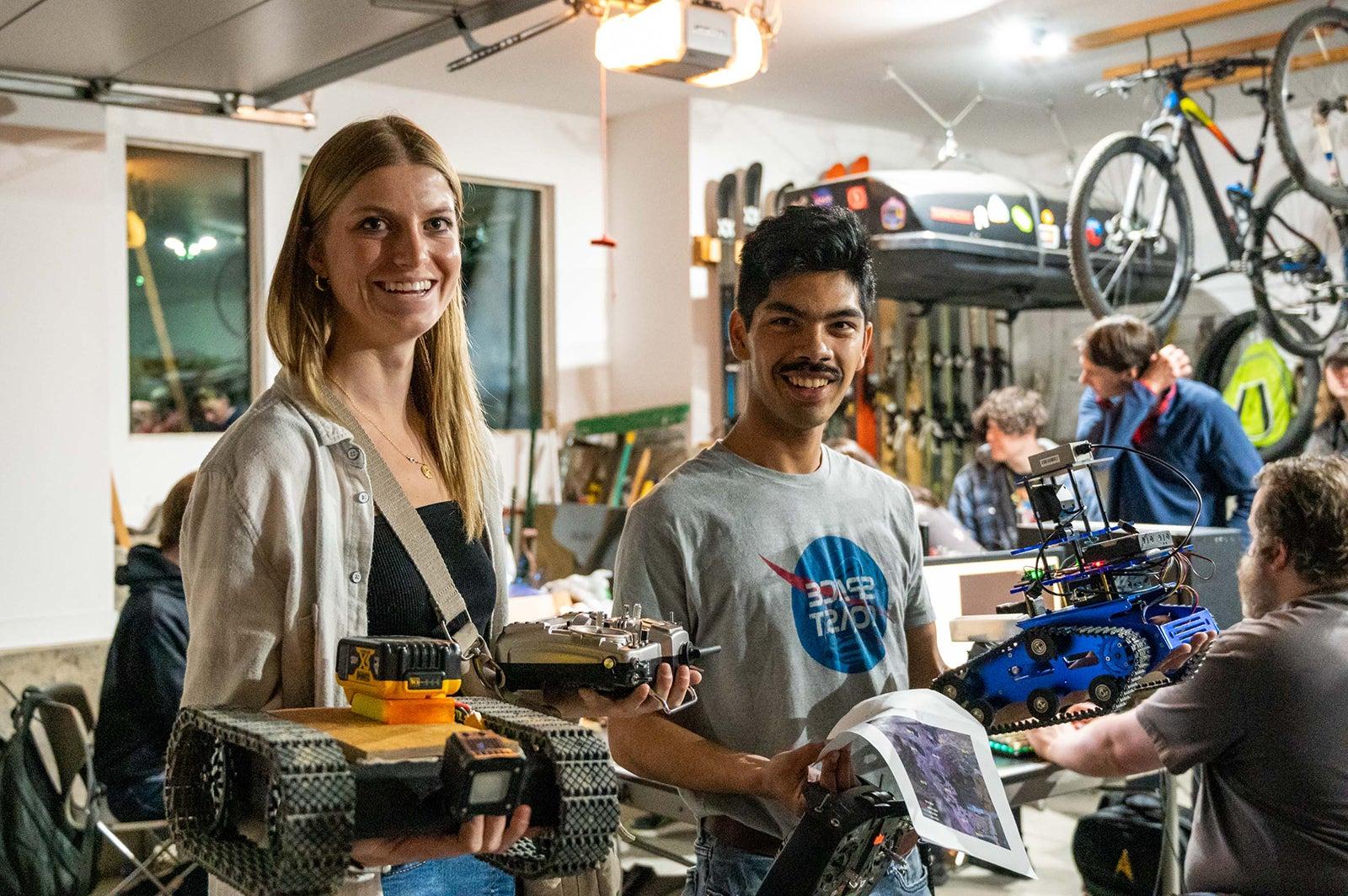 students with prototypes in a garage